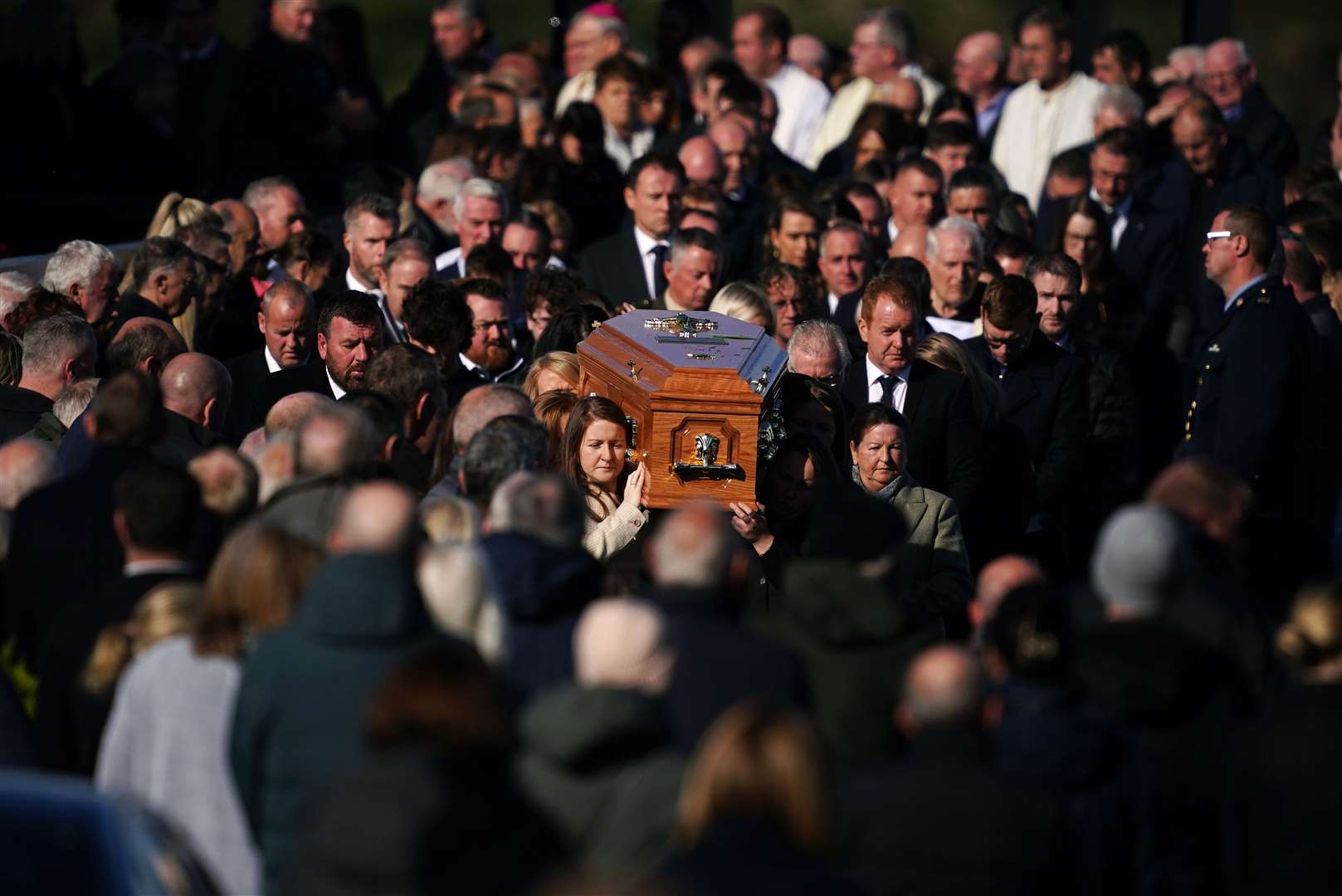 The coffin of Hugh ‘Hughie’ Kelly is carried from St Michael’s Church in Creeslough on Friday (Brian Lawless/PA)