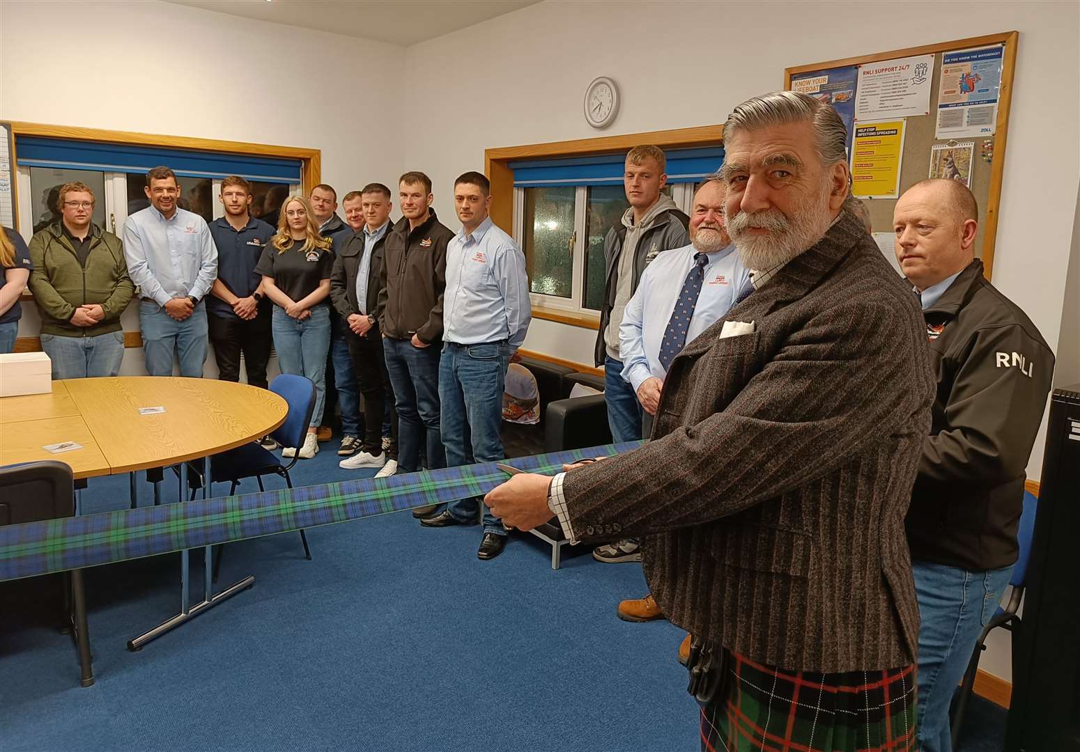 Lord Thurso cutting the ribbon at the refurbished upstairs area in Thurso lifeboat station.