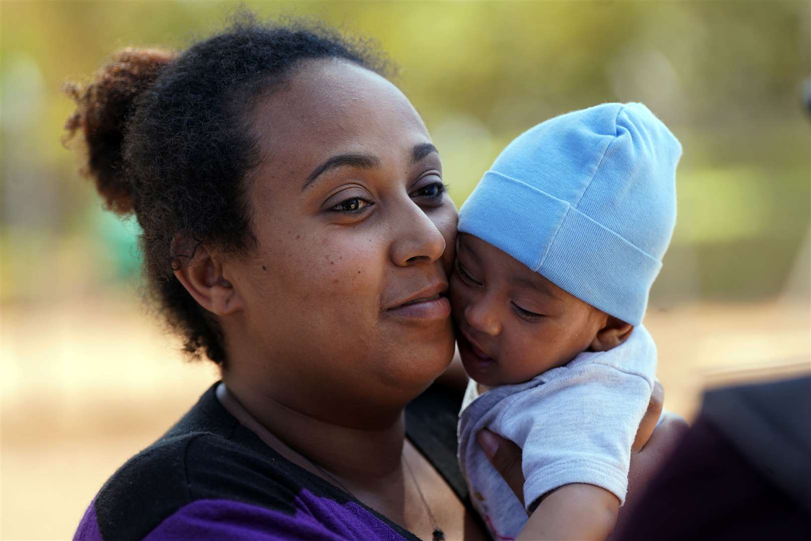 Resident Meseret Girmy, 24, and her three-month-old son Amin (Victoria Jones/PA)