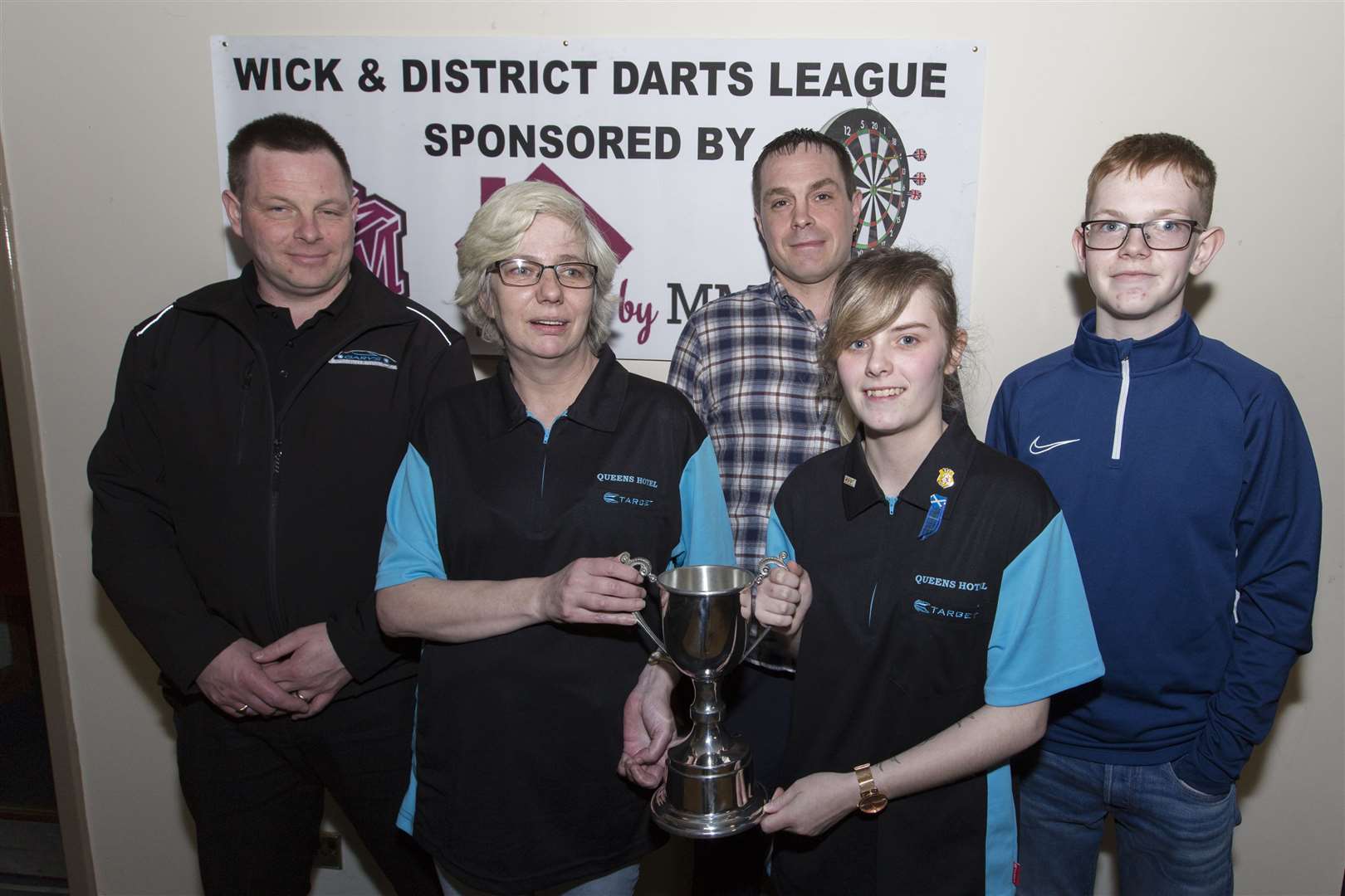 Ladies' winners in the Ray Sinclair Memorial Cup were Freda Perry and Kara Sutherland, of the Queen's Hotel. Looking on are Ray's sons, Gary (left) and Graeme, along with Gary's son Craig. Picture: Robert MacDonald / Northern Studios