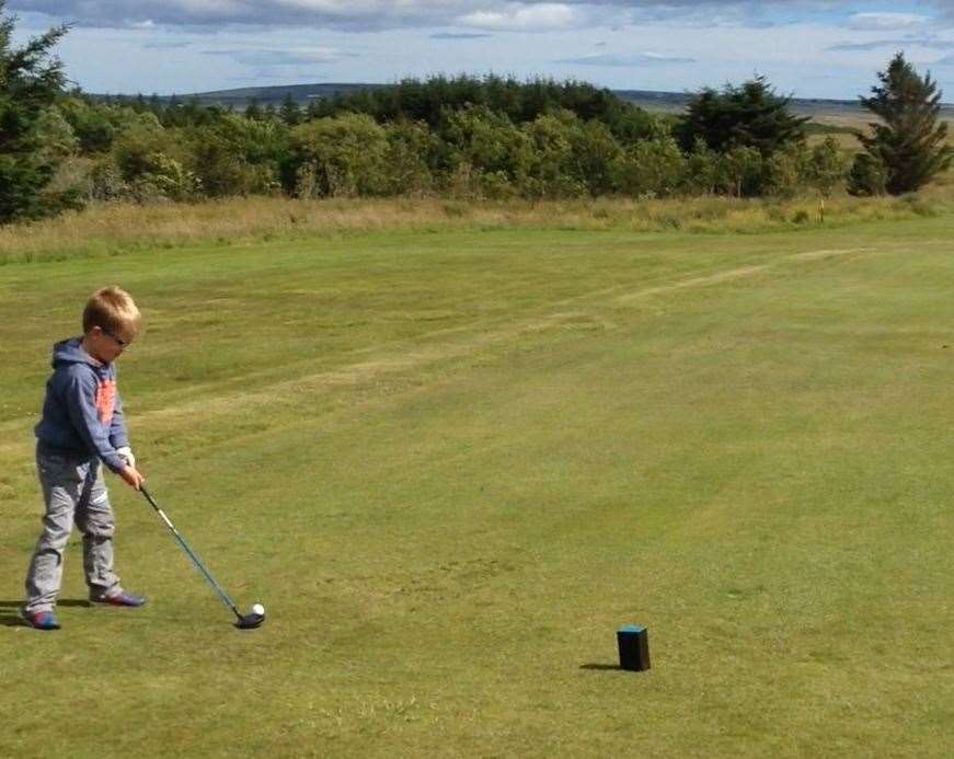 A quick learner: Tyler on the golf course when he was six.
