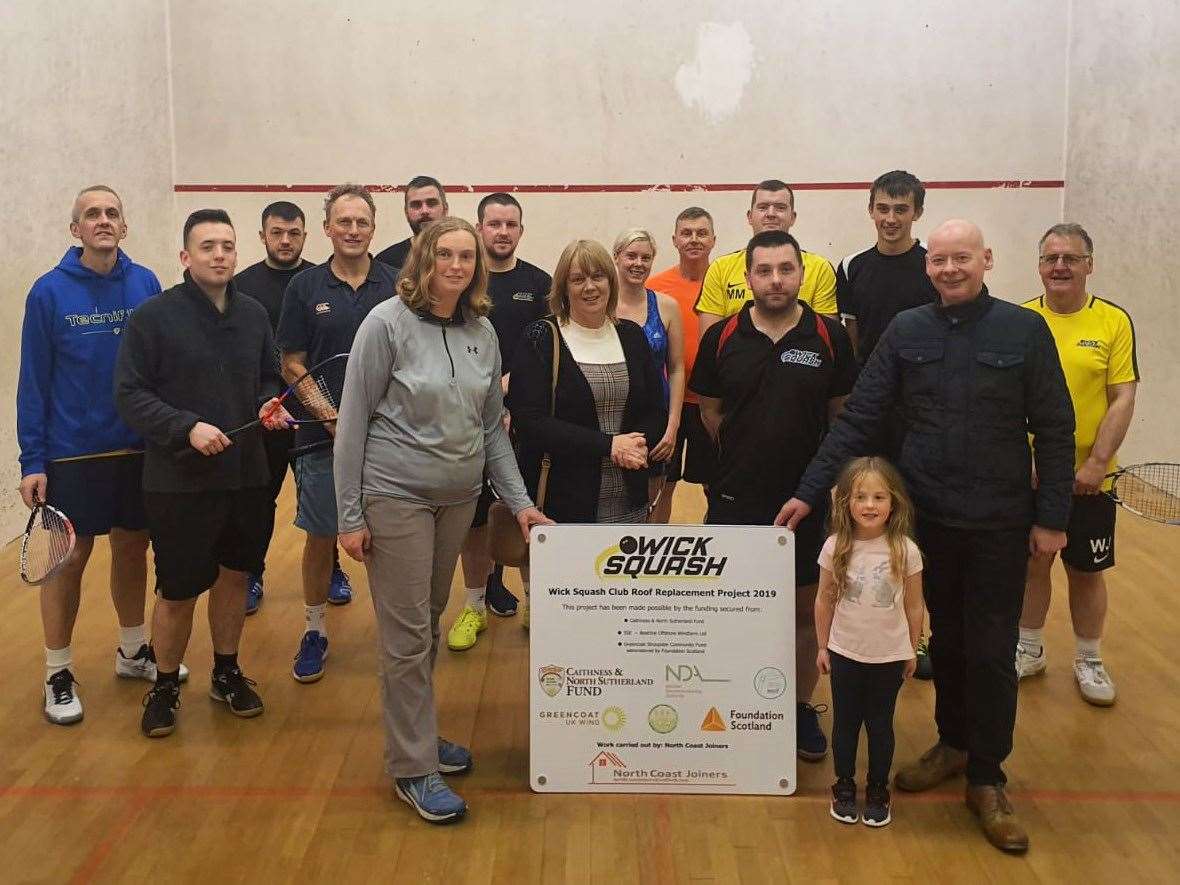 Wick Squash Club members at their first competition of the season along with representatives from the funding bodies.