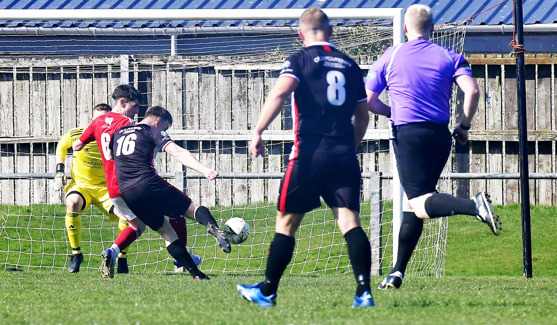 Jamie Flett fires the ball past keeper Sean McIntosh for Wick Academy's opening goal against Deveronvale. Picture: Mel Roger