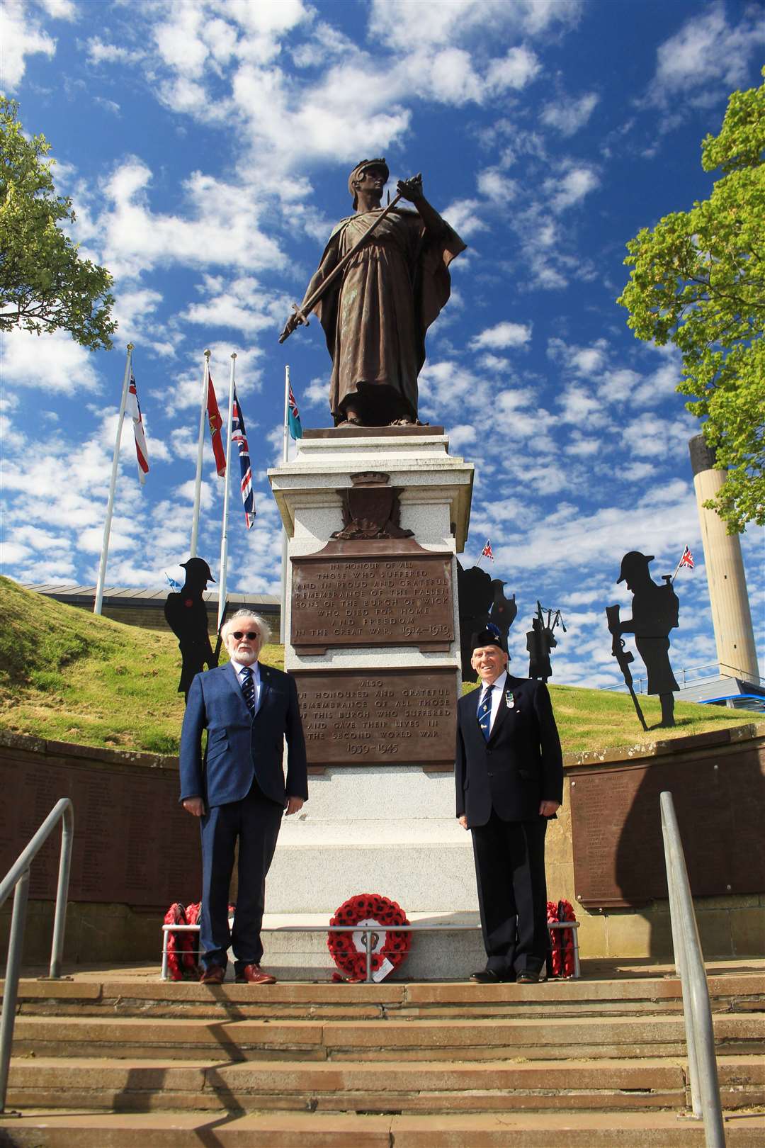 Murray Lamont (left) and Alex Paterson, president and chairman respectively of the Wick, Canisbay and Latheron branch of the Royal British Legion Scotland, at the Wick war memorial after a wreath-laying to mark the 80th anniversary of VE Day. Picture: Alan Hendry