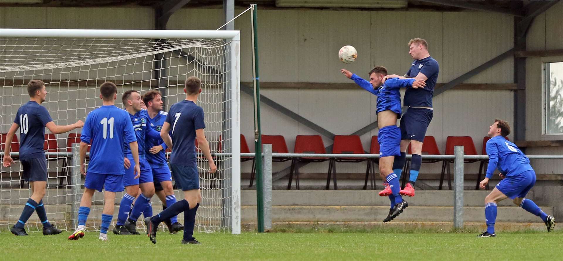 Aidan Reid rises above Danny Coghill to score High Ormlie's first goal against Wick Thistle with a powerful header. Picture: James Gunn