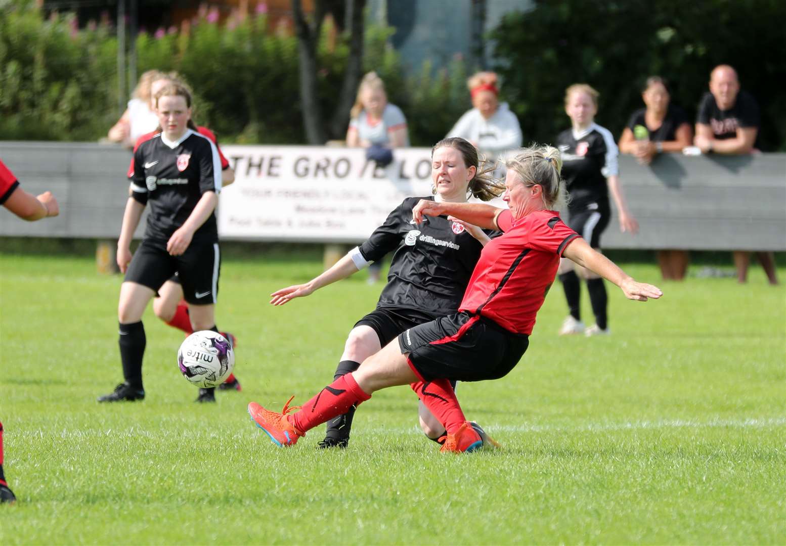 Brora defender Mary Stewart tackles Carly Erridge of Caithness during Sunday's league game at the Dammies. Picture: James Gunn