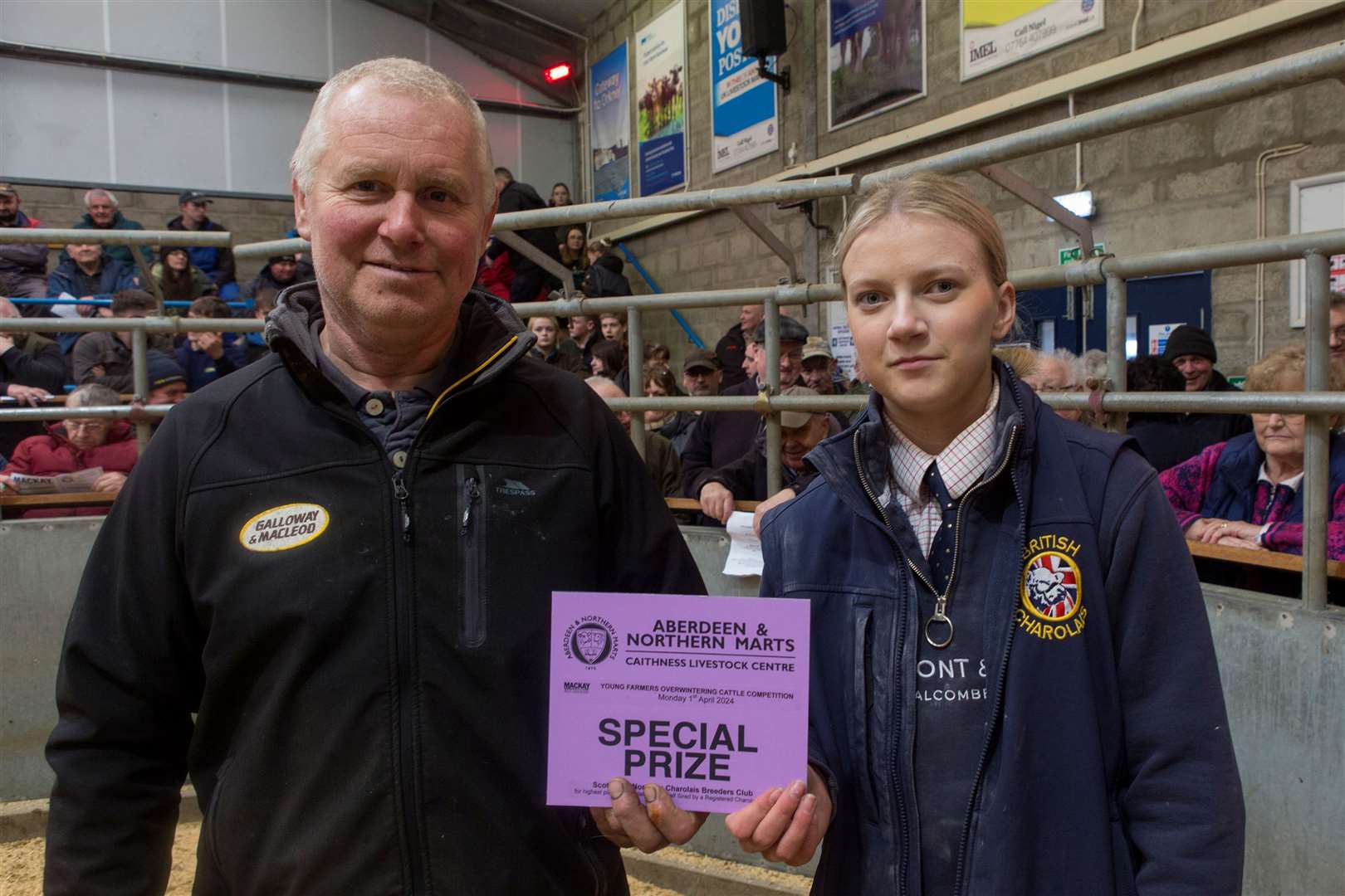 Sophie Gunn, Hill of Forss, received the special prize awarded by the Scottish and Northern Charolais Club for highest-placed Charolais cross calf. The award was handed over by Ron Mackay, West Clyth. Picture: Robert MacDonald / Northern Studios