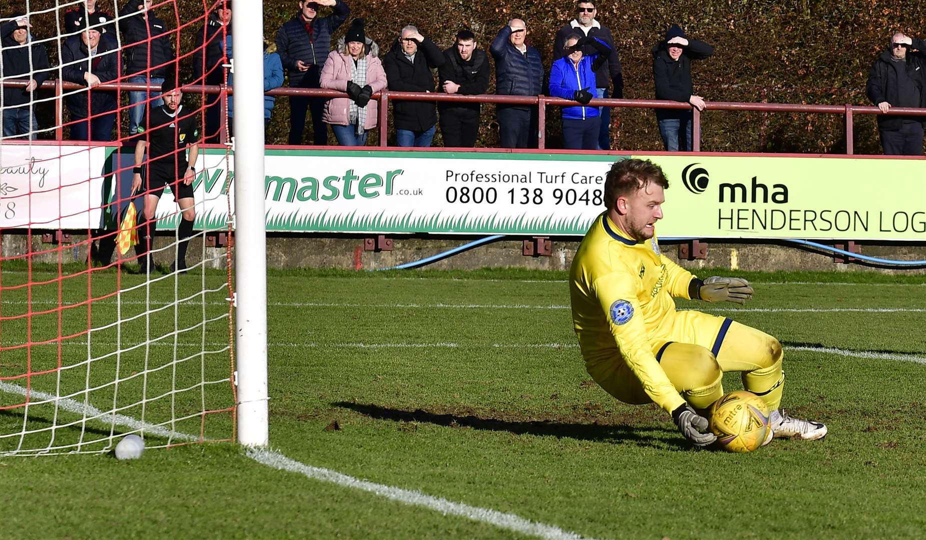 Wick Academy keeper Billy Miller gets down low to save a Brechin shot. Picture: Mel Roger