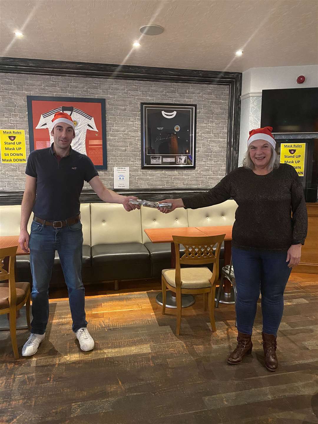 Thurso Community Development Trust board chairman Helen Allan (right) and board member Scotty Shearer getting into the festive spirit. They will be among the volunteers helping with the Thurso Community Christmas meal delivery.