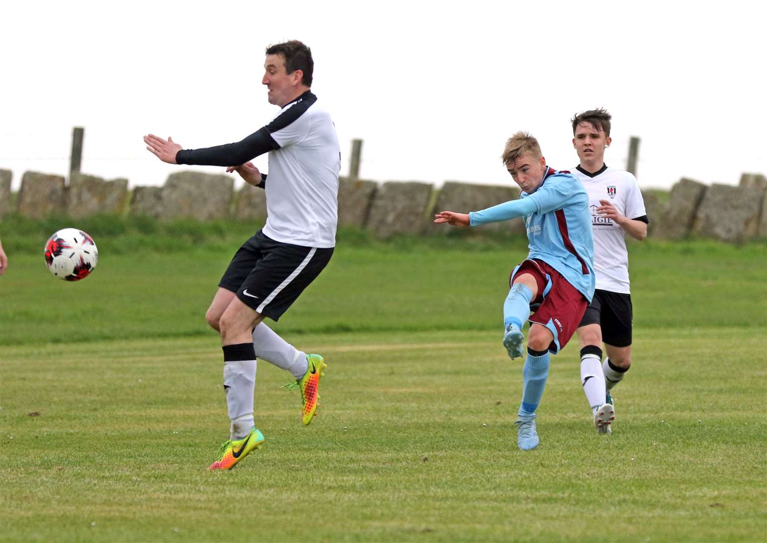 Pentland United's Cameron Montgomery fires in a shot past Andrew Bremner during the Dunnet side's 8-0 demolition of Thurso Swifts in the preliminary round of the Highland Amateur Cup. Picture: James Gunn