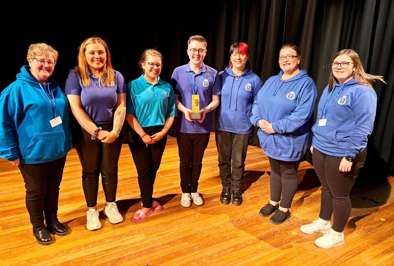 The senior team from Wick Players, with chairperson Jenny Szyfelbain and director Jayden Alexander, after receiving the Adam Swanson Memorial Trophy.
