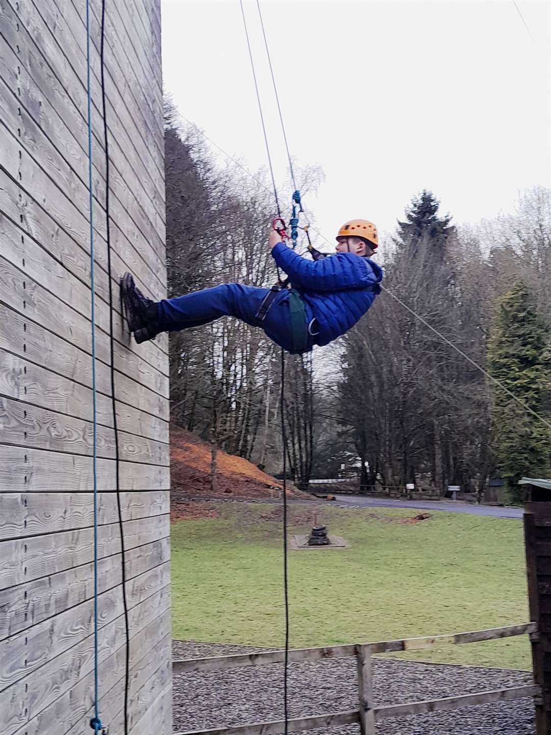 Quinn Greaves-Newall having a go at abseiling.