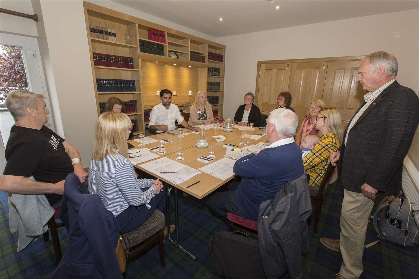 Scotland's health secretary Humza Yousaf meeting Ron Gunn (right) and other members of Caithness Health Action Team in Wick's Norseman Hotel in August. Picture: Robert MacDonald / Northern Studios