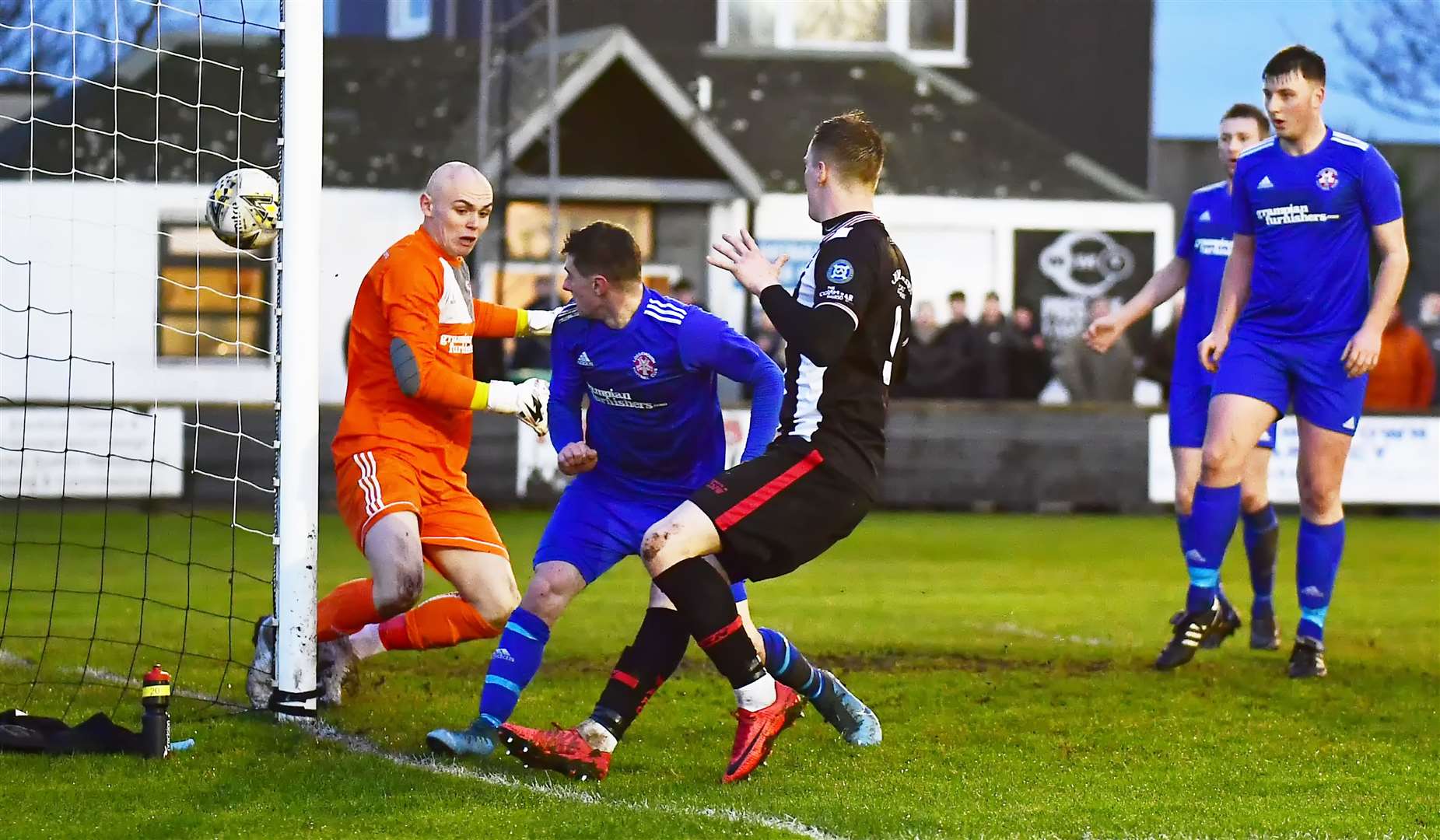 Lossie's Ross Archibald looks in dismay as he knocks the ball past his goalkeeper Logan Ross. Picture: Mel Roger