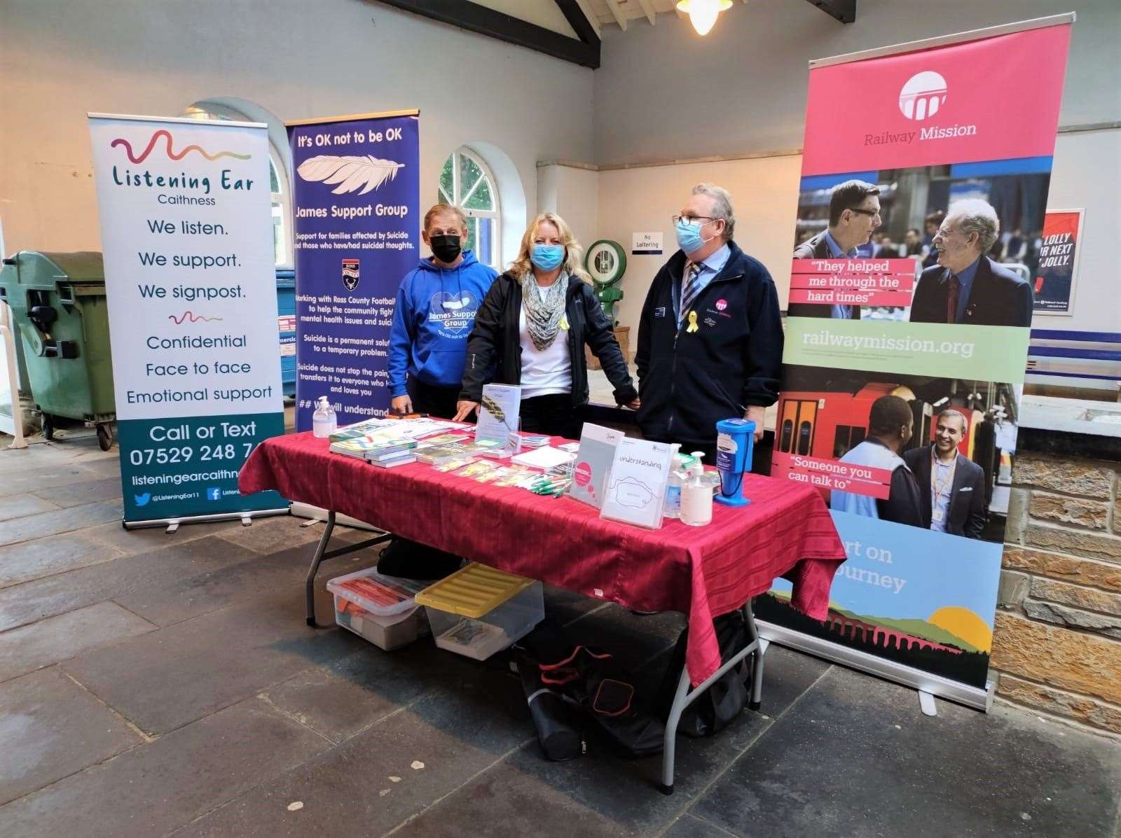 Volunteers at the pop-up stall in the Wick railway station.