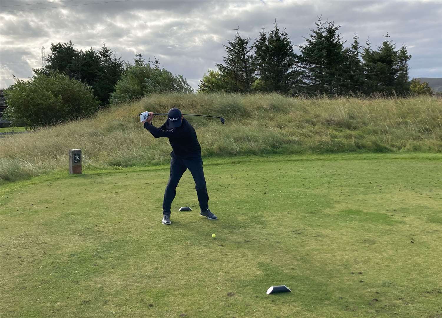 Gavin Gunn teeing off at the 16th hole during the North Point Distillery Open at Reay Golf Club.