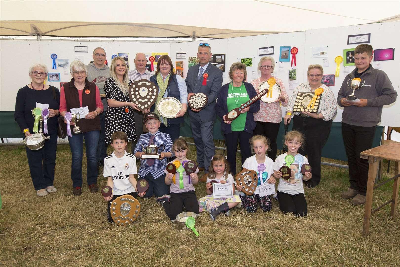 Shirley Mackay (centre), of Thorsdale View, Thurso, received the trophies for best exhibit and most points overall in the industrial section. She is pictured receiving her trophies from Caithness Agricultural Society president John Murray and his partner Jessica Dreaves. Looking on are some of the other winners. Picture: Robert MacDonald / Northern Studios