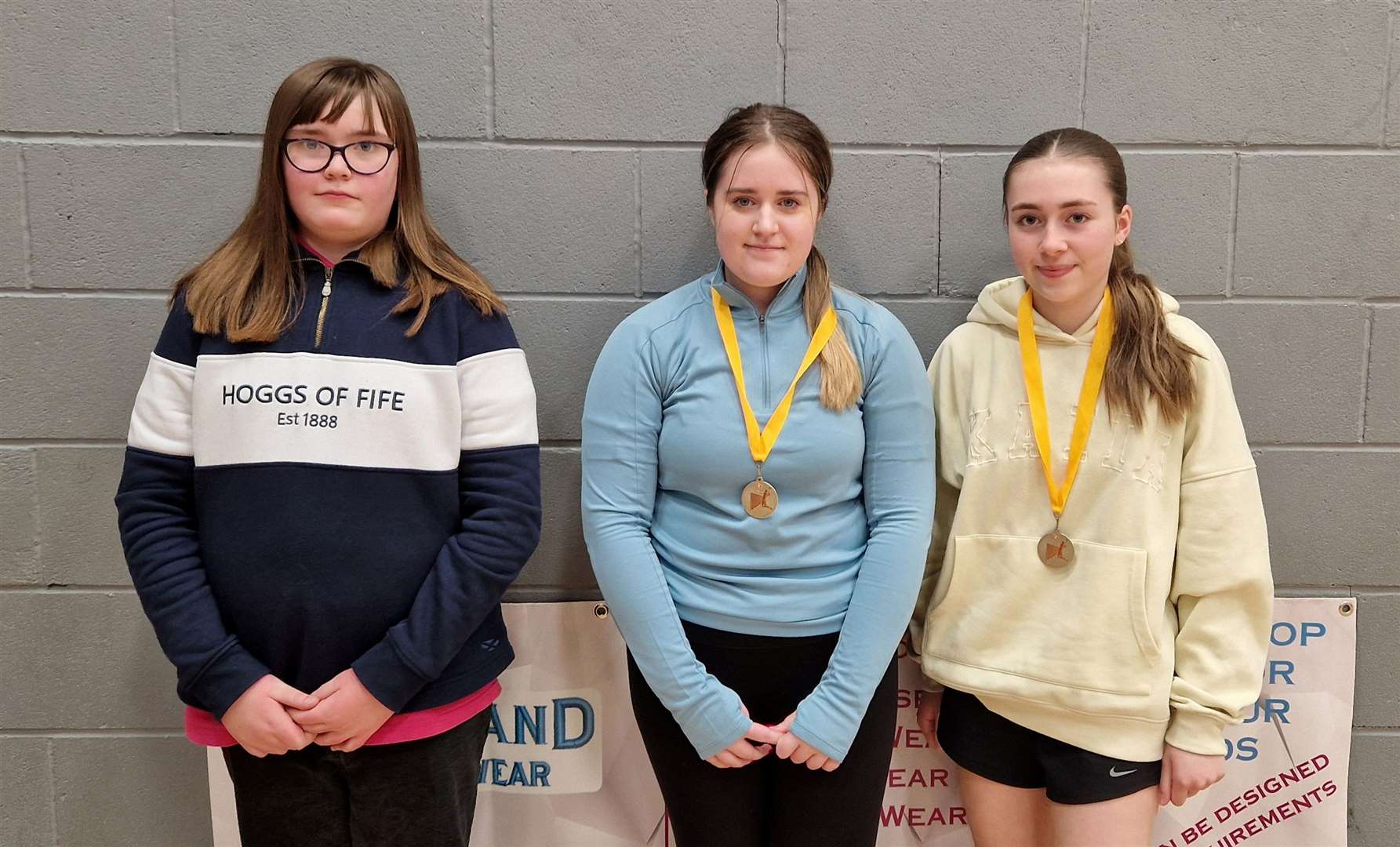 Girls' doubles consolation winners Hallie Bremner and Freya Mackay alongside Lexie Mackenzie (left) from Highland Workwear.