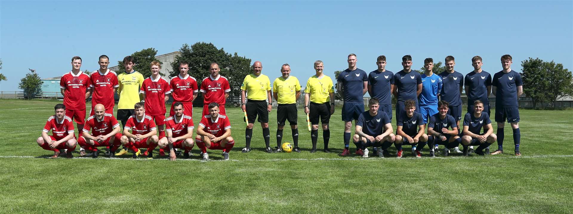 Wick Groats and High Ormlie Hotspur line up with the match officials before the start of the Eain Mackintosh Cup final at Recreation Park in Halkirk. Picture: James Gunn