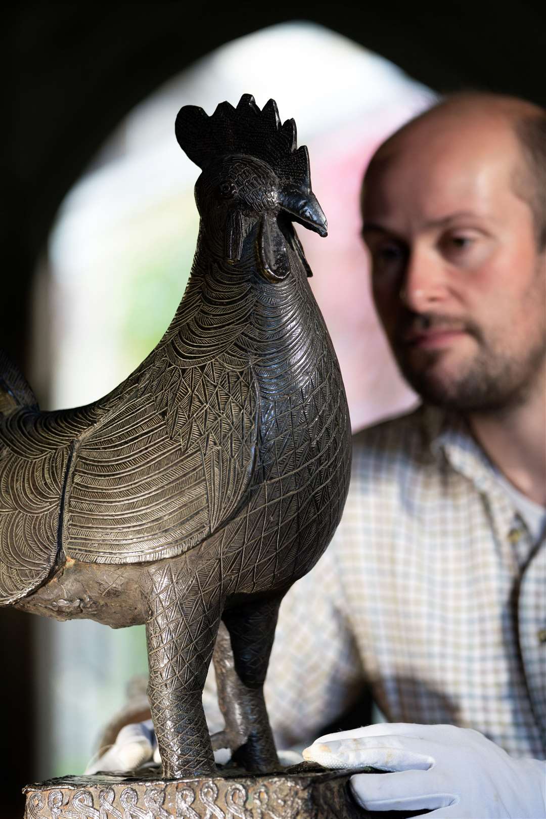 Archivist Robert Athol with the bronze statue (Joe Giddens/PA)