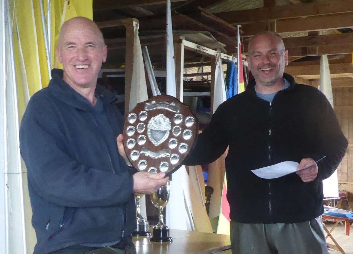 Sunday trophy winner Archie Miller with club president Kevin Paterson on the right.