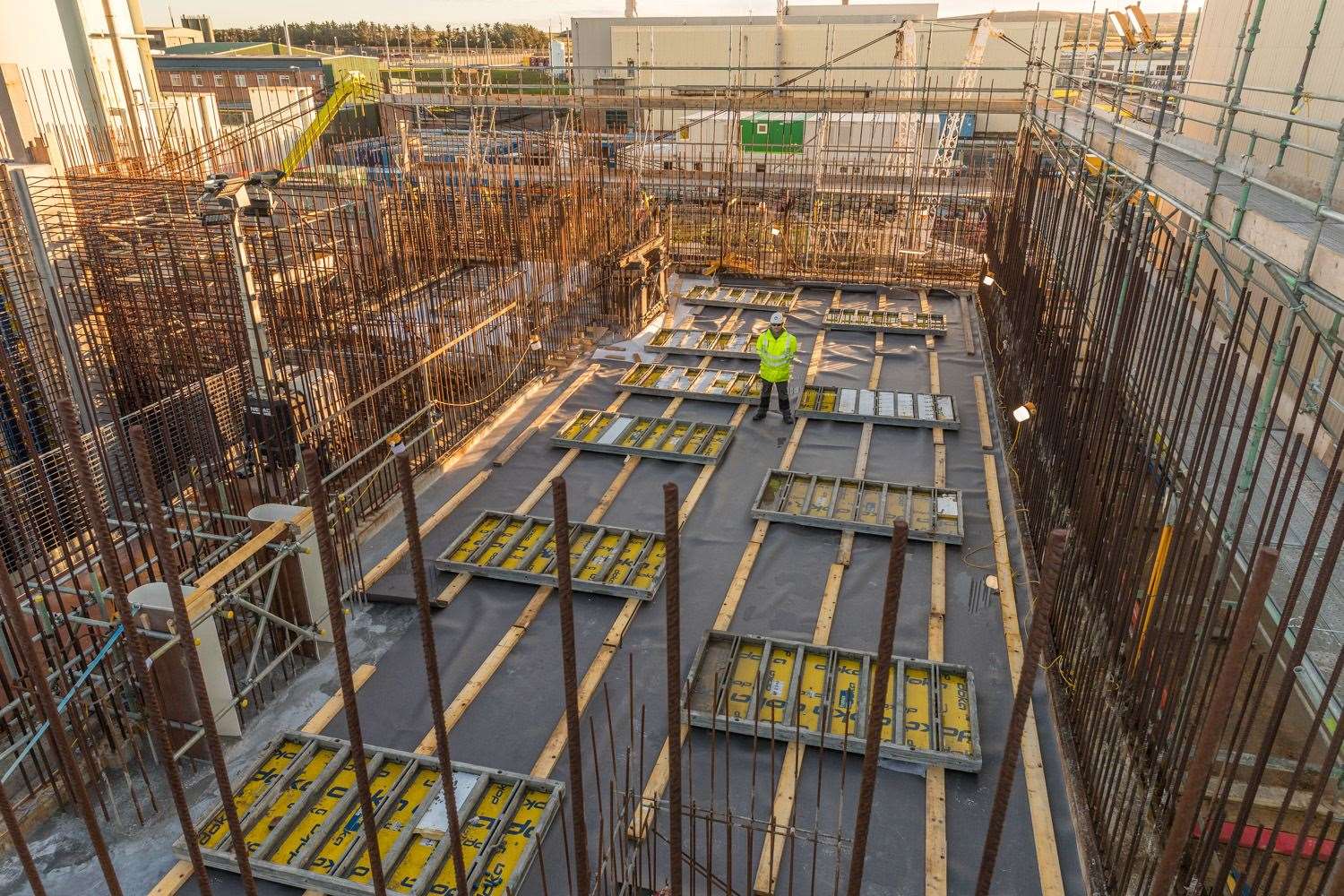 Casting the crane maintenance bay floor slab was described as a significant construction milestone for the project.