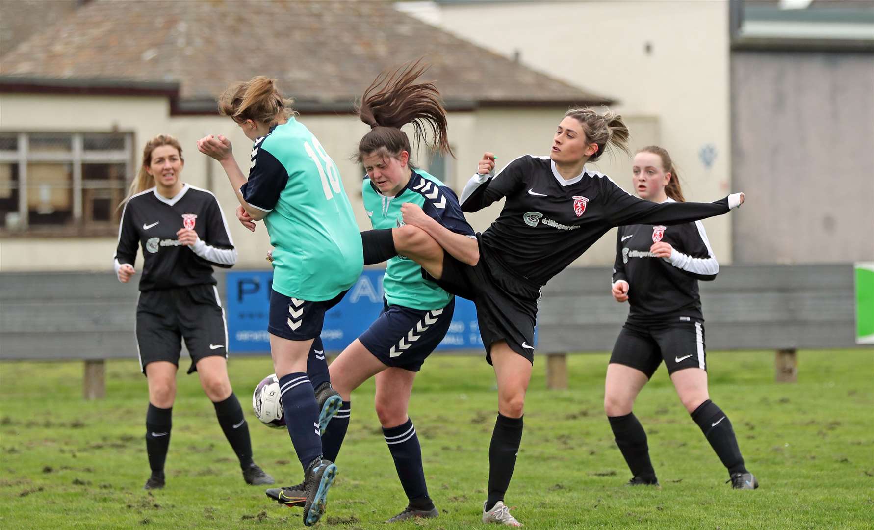 Caithness defender Sarah Henderson gets in a tangle with Buckie opponents. Picture: James Gunn