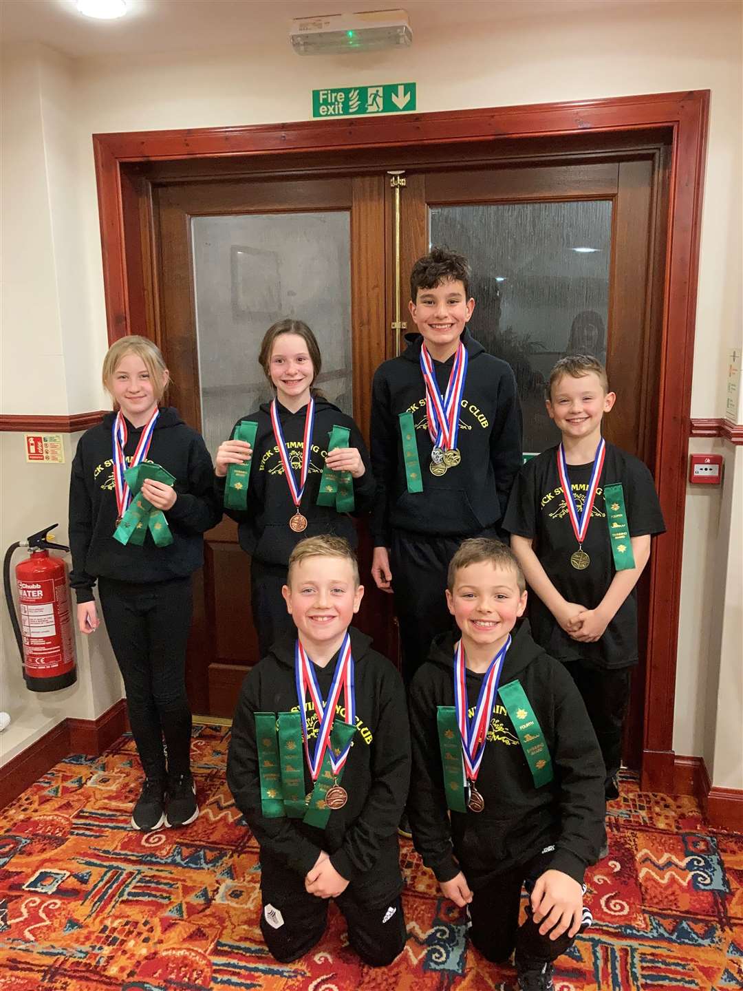 The team from Wick Amateur Swimming Club with their medals.