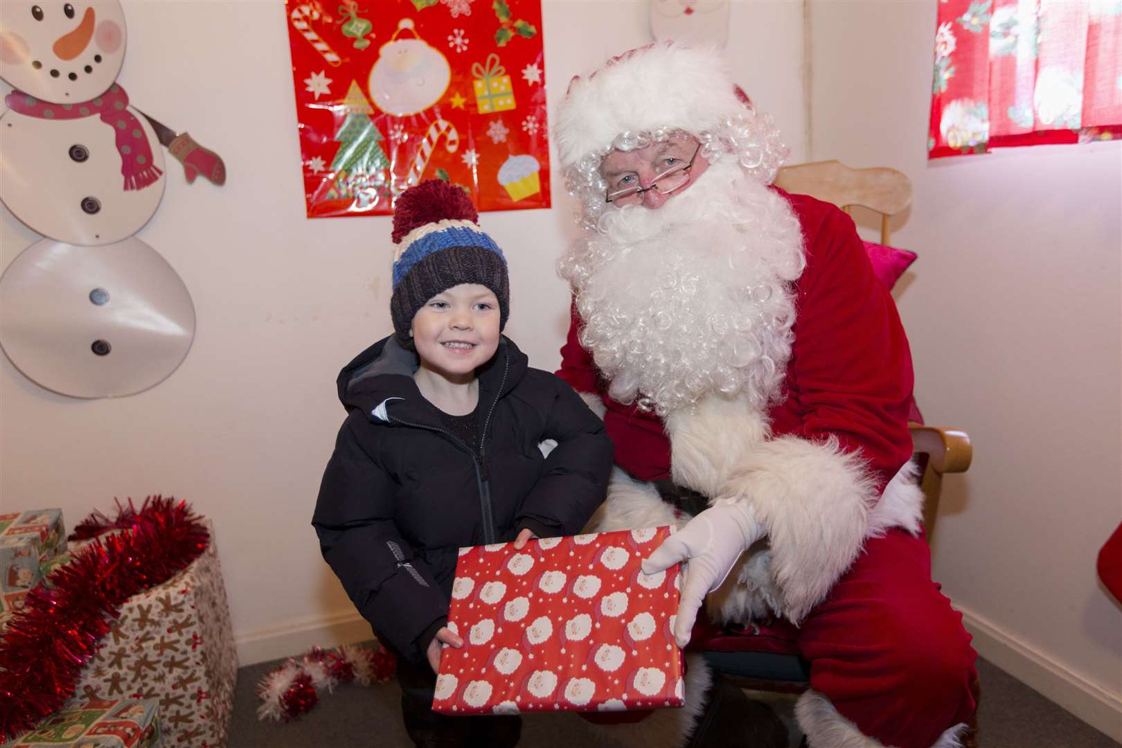 Harry Souter with Santa during Wick Fun Day. Picture: Robert MacDonald / Northern Studios