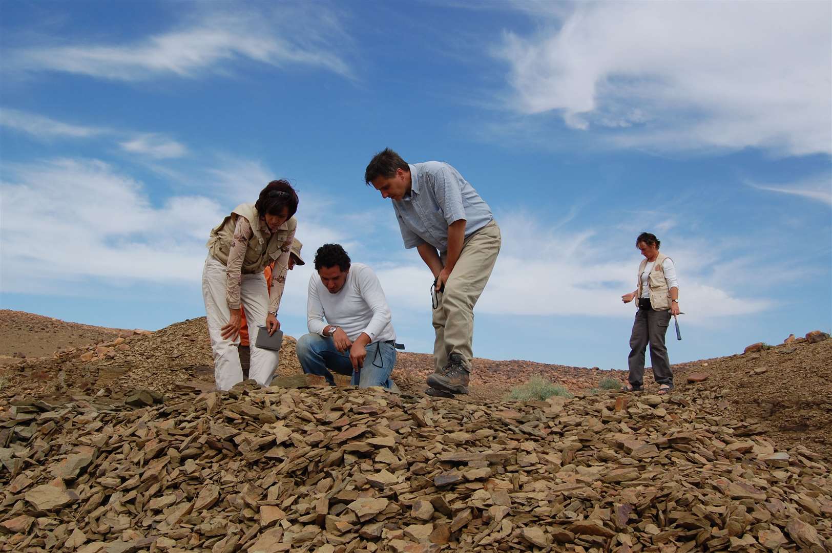 Researchers scour the Fezouata fossil site in Morocco (Cambridge University/PA)