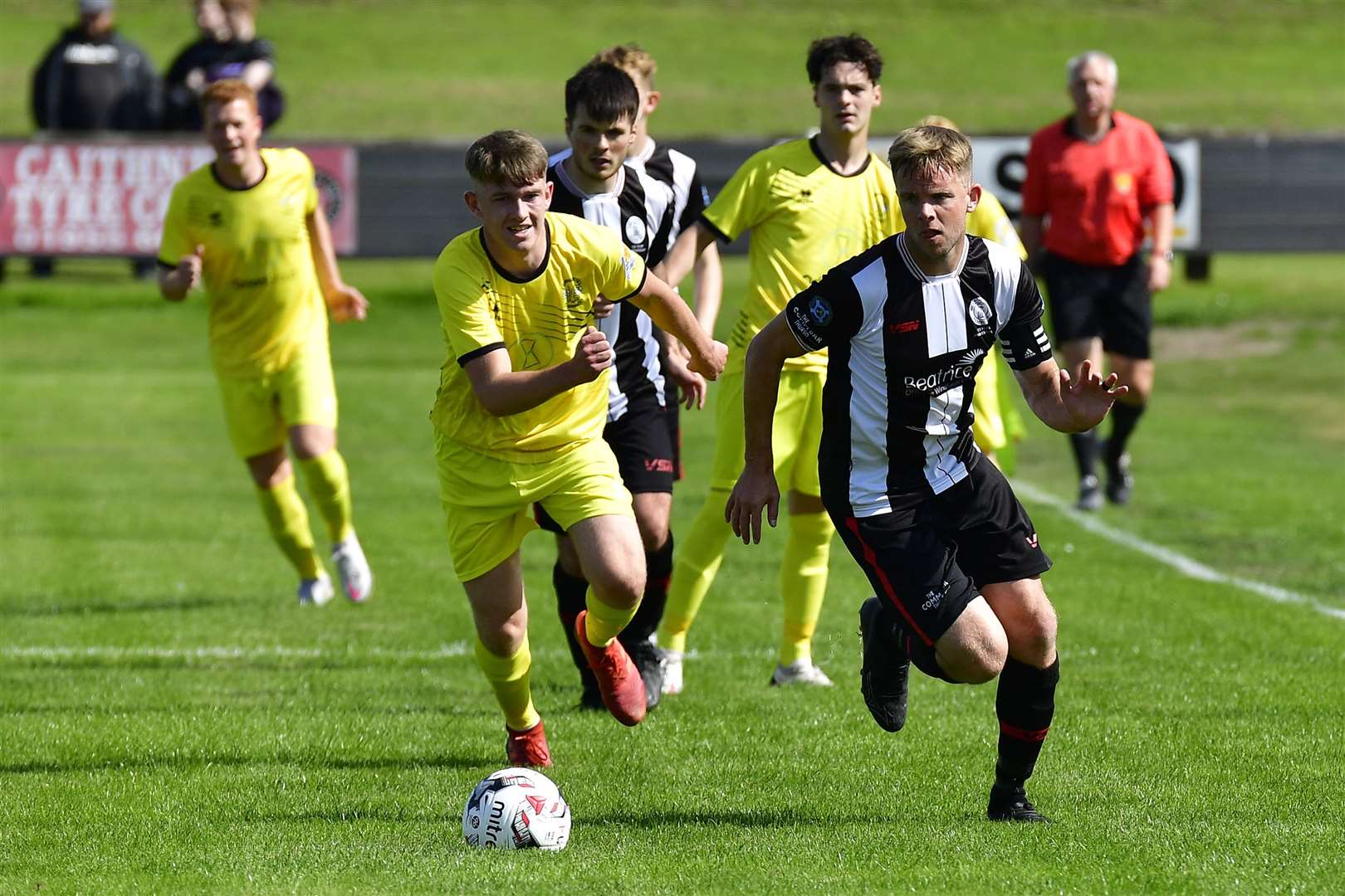 Alan Farquhar is chased by James Anderson during Wick Academy's 2-2 draw with Clachnacuddin at Harmsworth Park in August – this was Farquhar's last full game before injuring his right knee at Lossiemouth the following Saturday. Picture: Mel Roger
