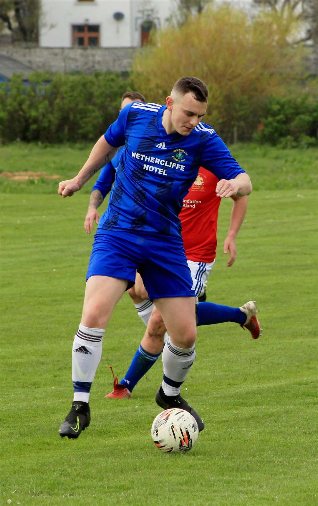 Wick Thistle's Lewis Harrold on the ball.