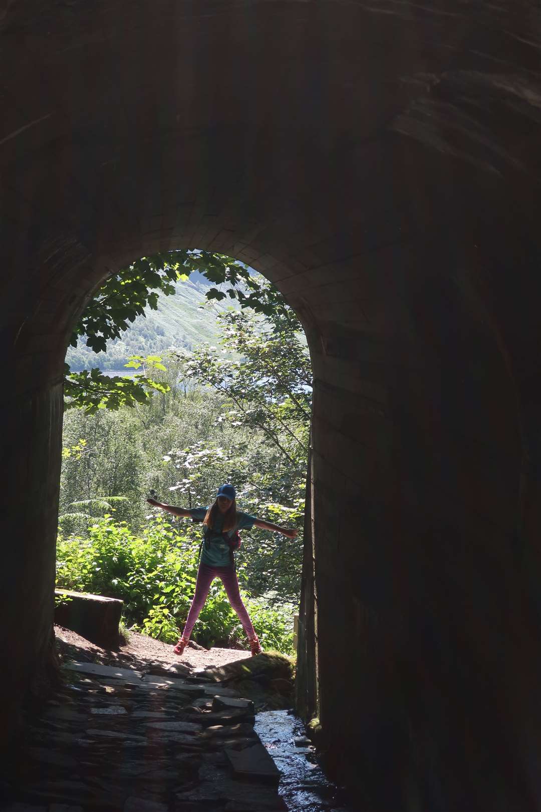 Clara at the far side of the tunnel near the station.