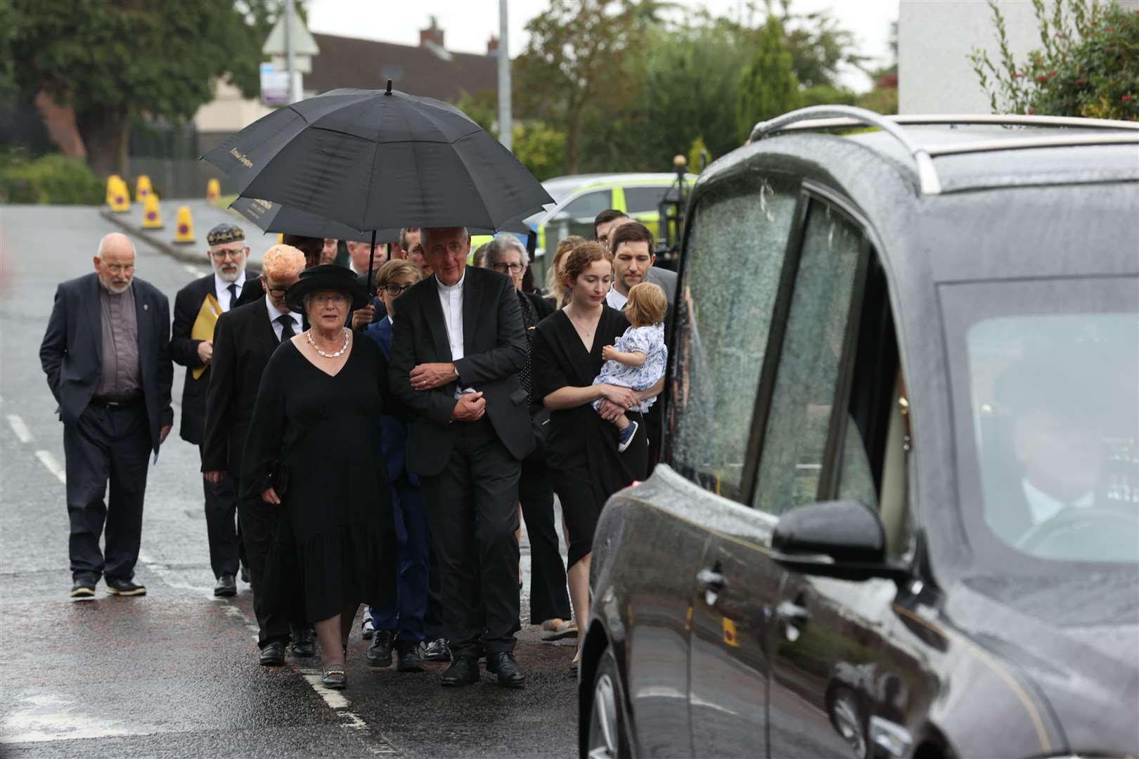 Lady Daphne Trimble (left) walks behind the hearse carrying the coffin (Liam McBurney/PA)