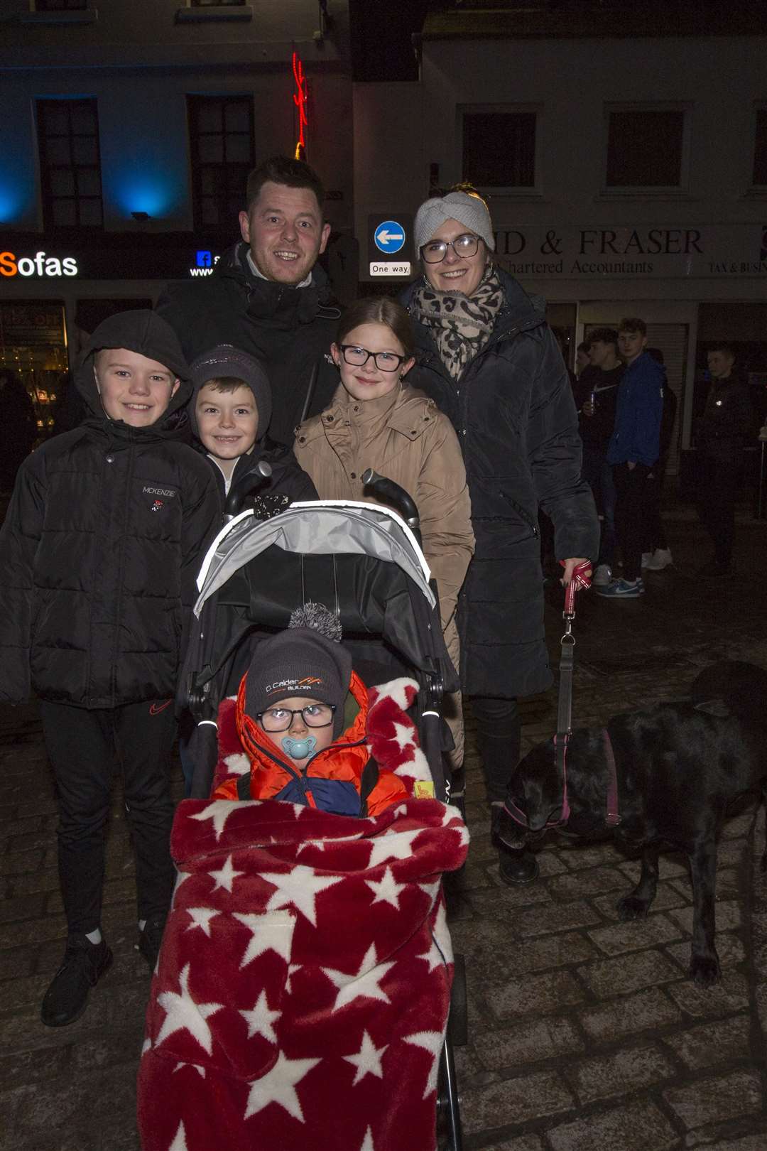 A family welcome for New Year from Davie and Emma Calder, their daughter Caitlyn, sons Robbie and Ben and nephew Ryan Little (left), along with Cali their dog. Picture: Robert MacDonald/Northern Studios