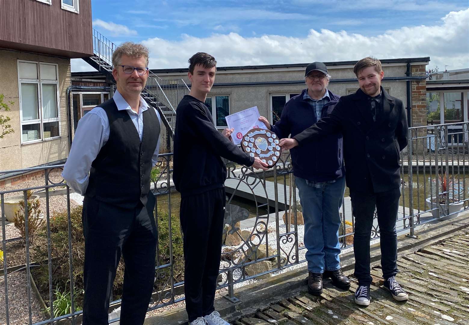 From left: Depute rector Craig Omand, winner Callum Prideaux, and local Labour members John Deighan, whose son Marc won it in 2016, and Alistair MacIvor.