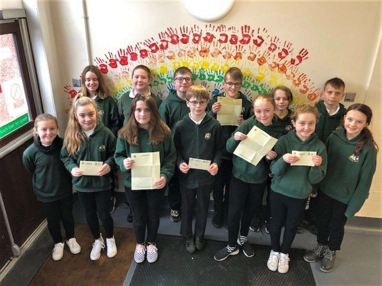 Pennyland P7 pupils with their letters from MP Jamie Stone.