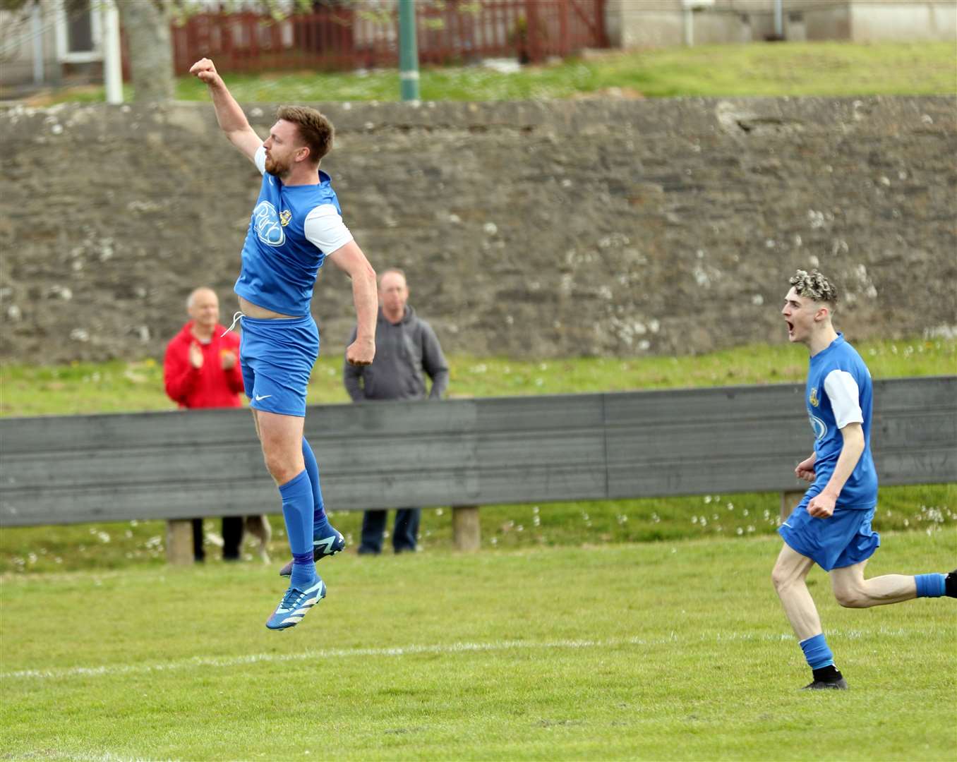 Andy Hardwick jumps in delight after heading in the third goal for Acks against Lochinver. Picture: James Gunn