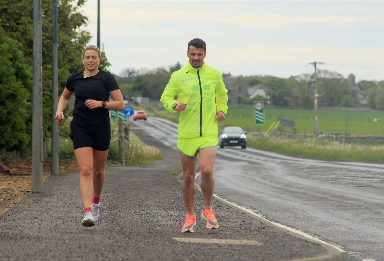 Steven Mackay and fellow runner Seana Forbes heading out of Wick. Picture: Alan Hendry