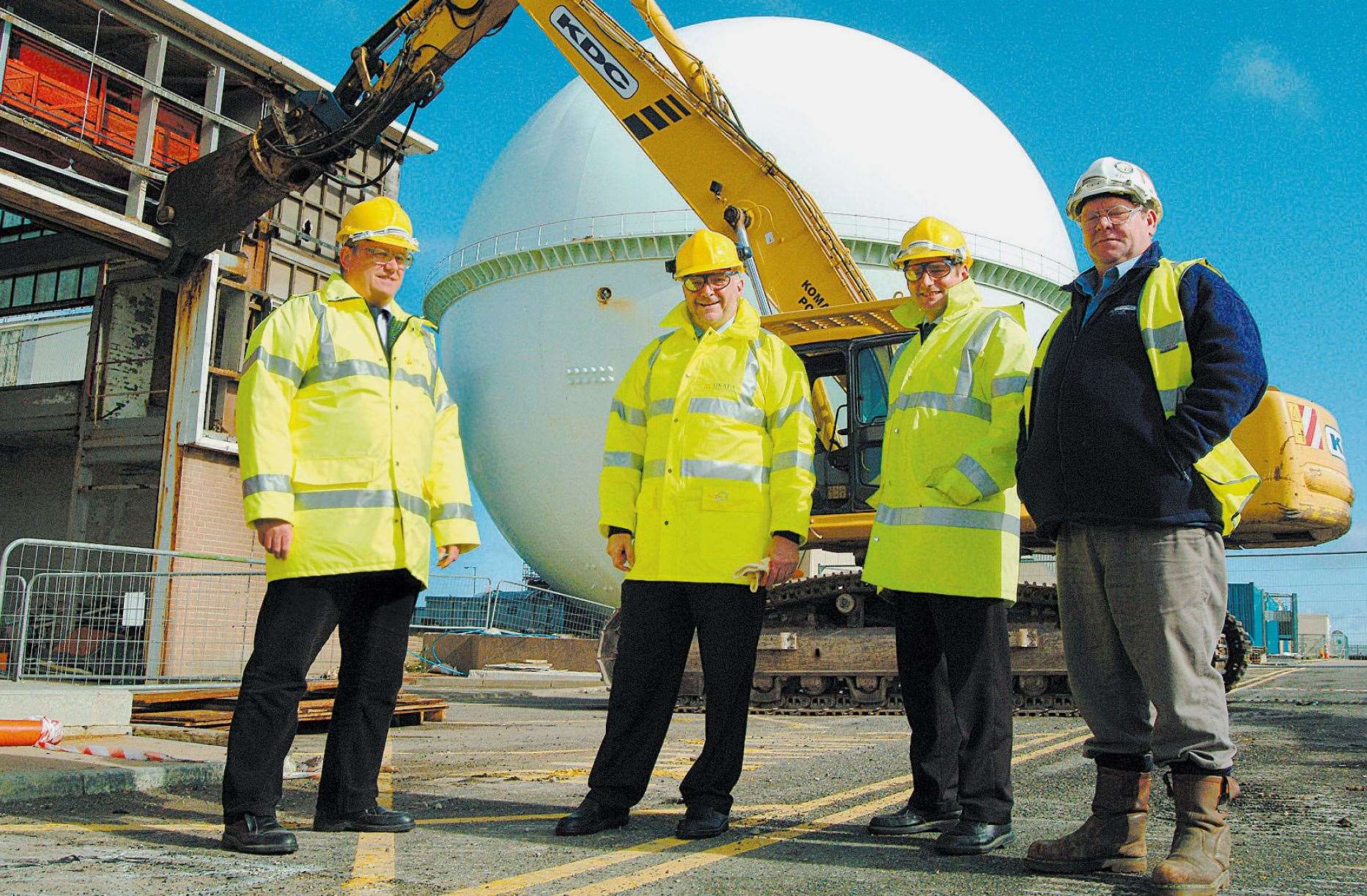 Mike Brown, Norman Harrison, John Smith and Colin Martin in 2005 with demolition under way on a large building adjacent to the Dounreay Fast Reactor.