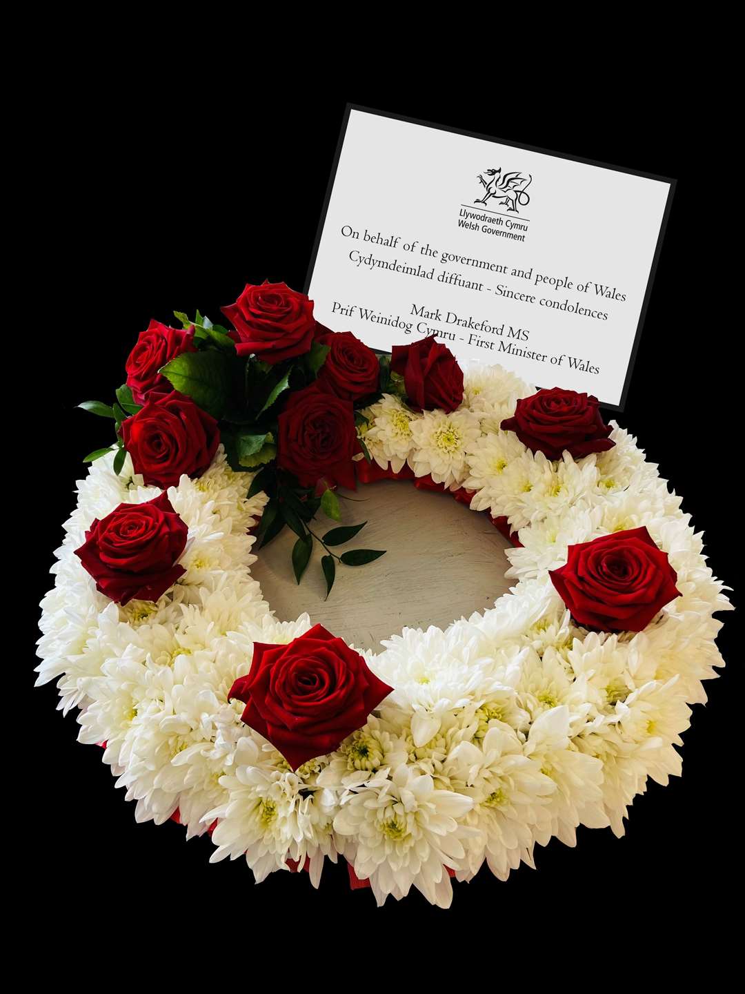 A flower wreath sent by First Minister of Wales Mark Drakeford on behalf of the government and people of Wales (Welsh Government/PA)