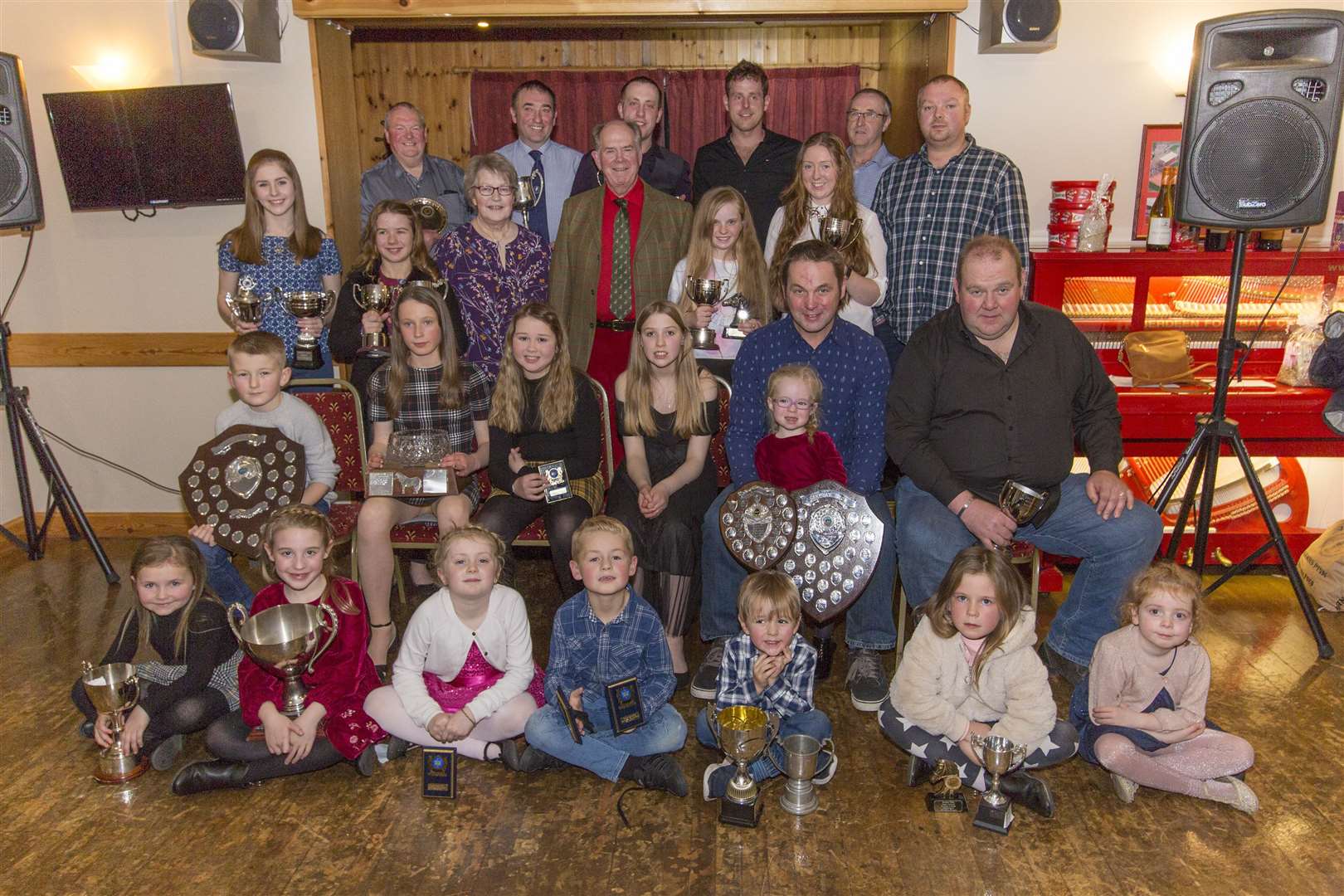 Some of the trophy-winners from this year's Canisbay Show pose for a photograph along with guest speaker, retired Canisbay Church of Scotland minister Lyall Rennie (standing, centre) and his wife Isobel (centre, left). The presentations took place during a dinner in the Seaview Hotel, John O'Groats, on Saturday night. Picture: Robert MacDonald / Northern Studios