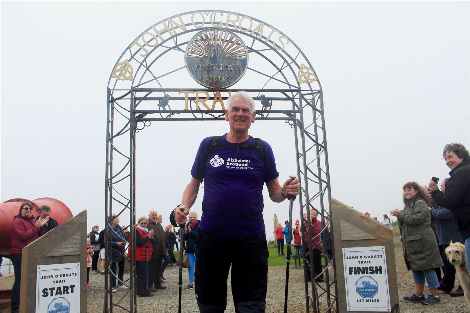 Frank Stephen crosses the finishing line on his walk of the John O’Groats Trail last year. Picture: Alan Hendry