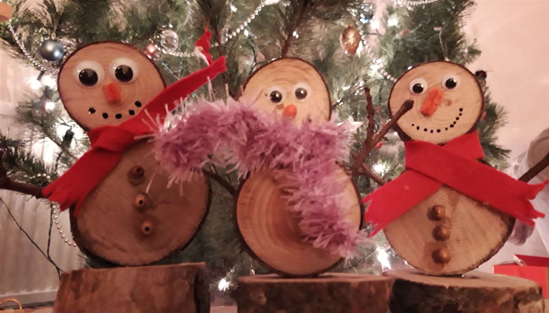 Some of the environmentally friendly wooden snowmen.