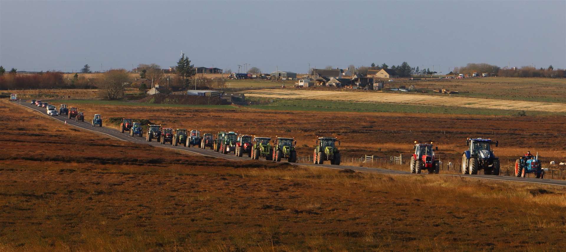 The convoy heading over the Killimster Moss road during Saturday's inaugural William Gunn Memorial Tractor Run. Picture: Neil Buchan