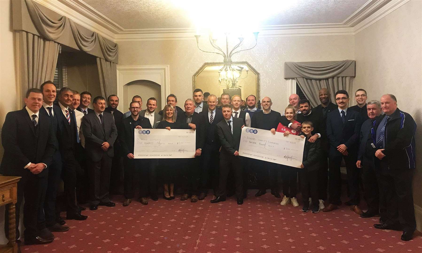 The cheques for MND Scotland and the Rangers Charity Foundation are handed over at the sportsman's dinner in Thurso attended by former Rangers players Nacho Novo, Alex Rae and Marvin Andrews.