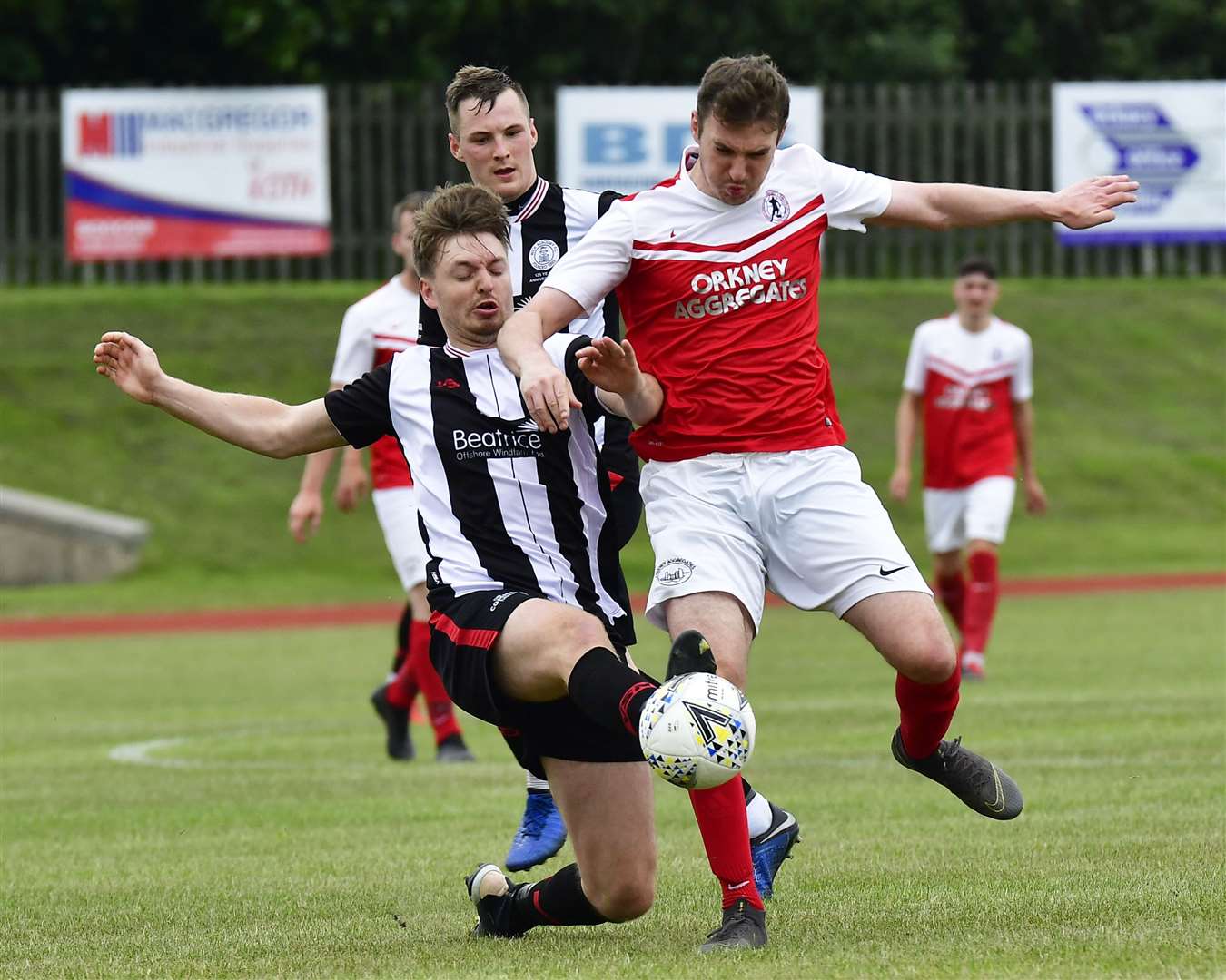 Defender Andrew Hardwick puts in a strong tackle during Wick Academy's recent pre-season win in Orkney. Picture: Mel Roger