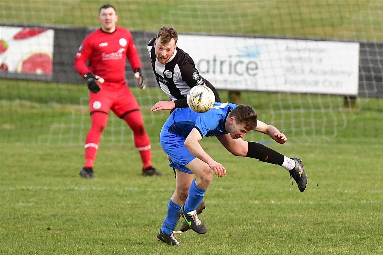 Wick Academy defender Rob McLean with a flying header to clear the danger. Picture: Mel Roger
