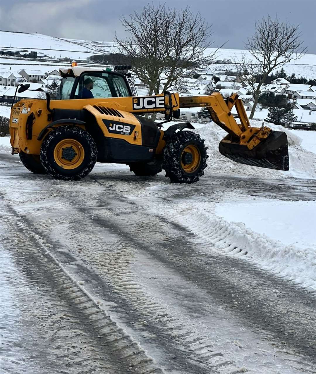 Working hard to remove the snow in Sir Archibald Road