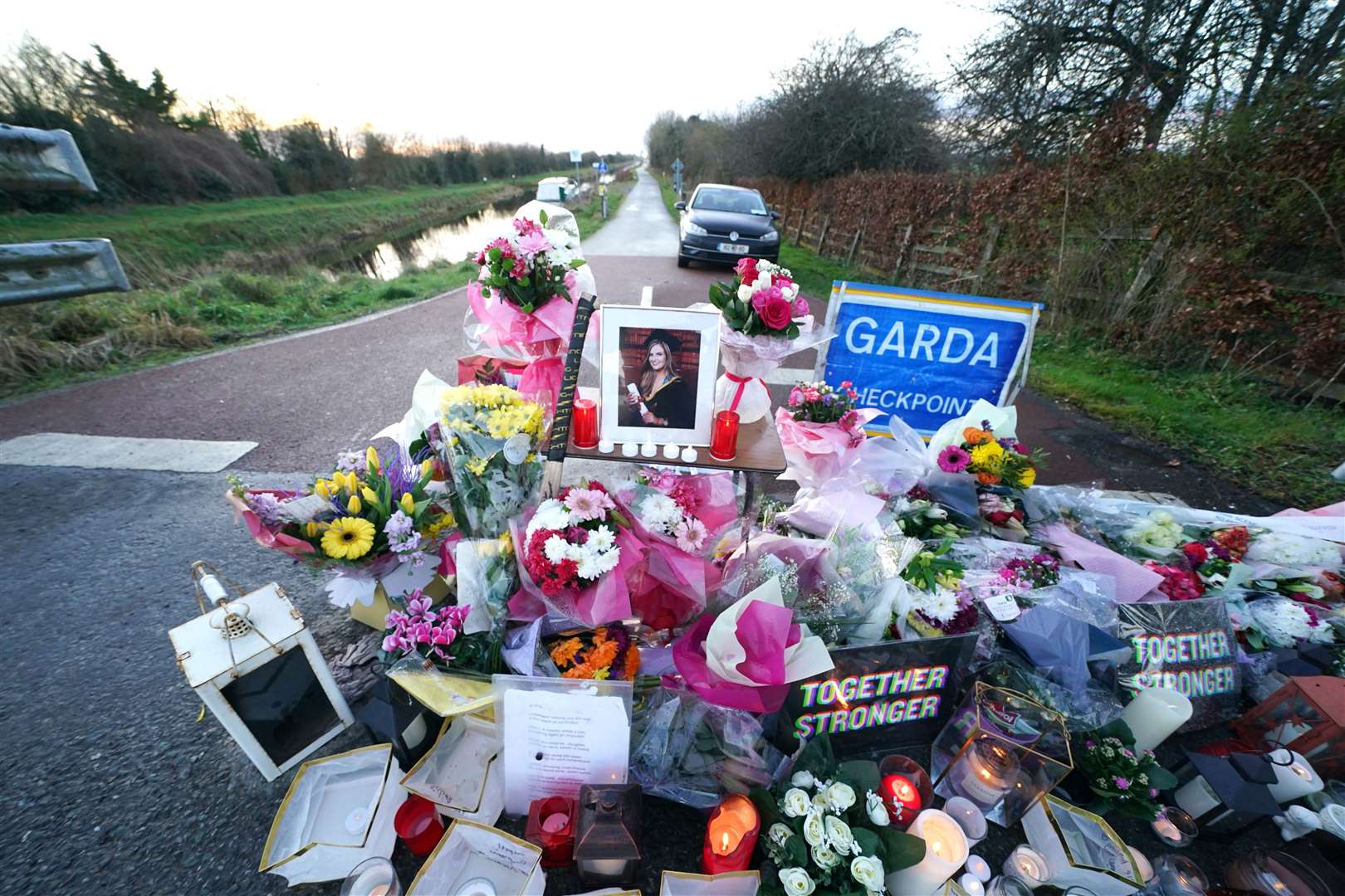 Floral tributes at the Grand Canal in Tullamore, Co Offaly, where primary school teacher Ashling Murphy died (Brian Lawless/PA)